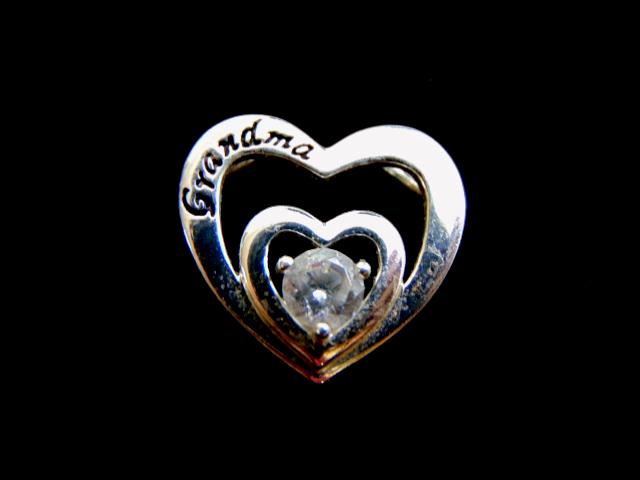Women's Vintage Sterling Silver Heart Grandma Pendant: FOR SALE IS THIS LOVELY VINTAGE STERLING SILVER HEART PENDANT. THE TOTAL WEIGHT IS 2.4g. THE PENDANT MEASURES 3/4" BY 3/4". MAKES A GREAT GIFT FOR THAT SPECIAL SOMEONE. ANY QUESTIONS, PLEASE DO NOT HE