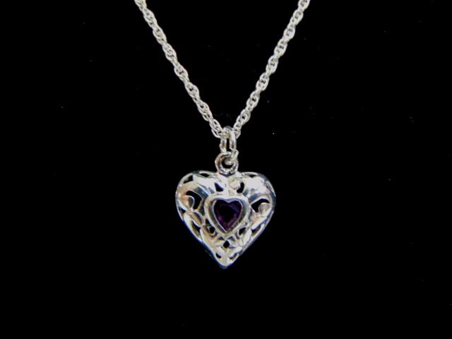 Womens Sterling Silver Amethyst Heart Necklace: A VERY NICE STERLING SILVER NECKLACE WITH A HEART PENDANT THAT WEIGHS 2.7g. THE PENDANT MEASURES 5/8" BY 1/2". THE NECKLACE MEASURES 16" LONG. THE CENTER STONE IS AMETHYST IN COLOR BUT NOT SURE IF IT 