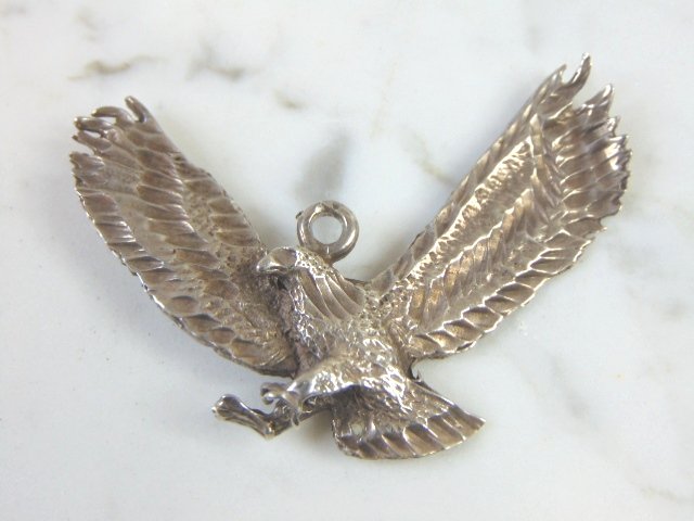 Vintage Estate Sterling Silver Eagle Pendant: FOR SALE IS THIS LOVELY VINTAGE STERLING SILVER EAGLE PENDANT. THE TOTAL WEIGHT IS 12.5g. THE PENDANT MEASURES 2 1/4" WIDE BY 2 1/2" LONG. MAKES A GREAT GIFT FOR THAT SPECIAL SOMEONE. ANY QUESTIONS, P