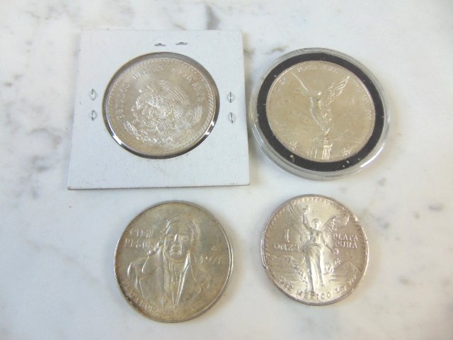 LOT OF 4 COLLECTIBLE  MEXICAN SILVER DOLLAR COINS (1 of 2)