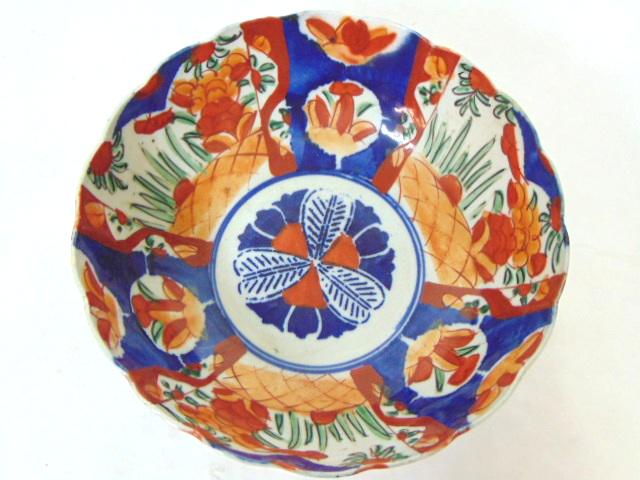 ANTIQUE HAND PAINTED JAPANESE PORCELAIN IMARI BOWL: A BEAUTIFUL ANTIQUE HAND PAINTED JAPANESE PORCELAIN IMARI BOWL. THE BOWL MEASURES 3 1/2" TALL BY ABOUT 9 5/8" IN DIAMETER. CONDITION OF THE PAIR IS GOOD FOR ITS AGE BUT AS YOU CAN SEE IT DOES HAVE TWO