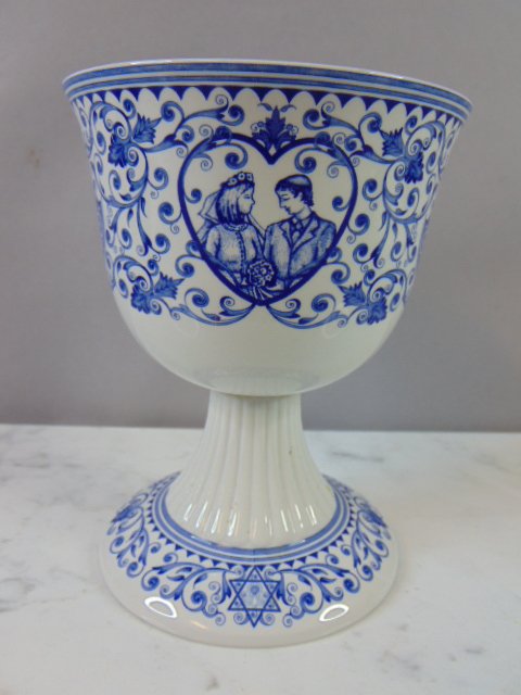 Spode Jewish Shabbat Kiddush Cup 2007: A Judaica Kiddush cup that was made by Spode of England in 2007. Cup measures 6" tall by 4 3/4" wide, and is in great condition.Shipping and handling is $20 within the Continental U.S. all other state