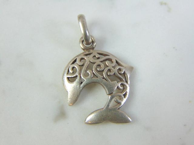 Womens Vintage Estate Sterling Silver Dolphin Pendant: FOR SALE IS THIS WOMENS VINTAGE ESTATE STERLING SILVER DOLPHIN PENDANT . PENDANT WEIGHS 2.3g AND PENDANT MEASURES 1 1/8" LONG BY 3/4" WIDE. MAKES A GREAT GIFT FOR THAT SOMEONE SPECIAL. IF ANY QUESTION
