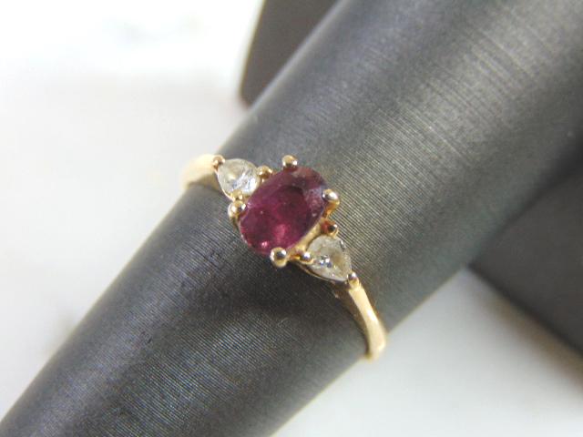 Womens Vintage Estate 14k Gold Garnet & Diamond Ring: THIS ITEM IS A WOMENS VINTAGE ESTATE 14K GOLD GARNET & DIAMOND RING. RING IS MARKED ON THE INSIDE "CID 14KP". THE SIZE OF THE RING IS A 7.0. RING WEIGHS 2.0g AND THERE ARE ABOUT .04cts OF DIAMONDS. NO