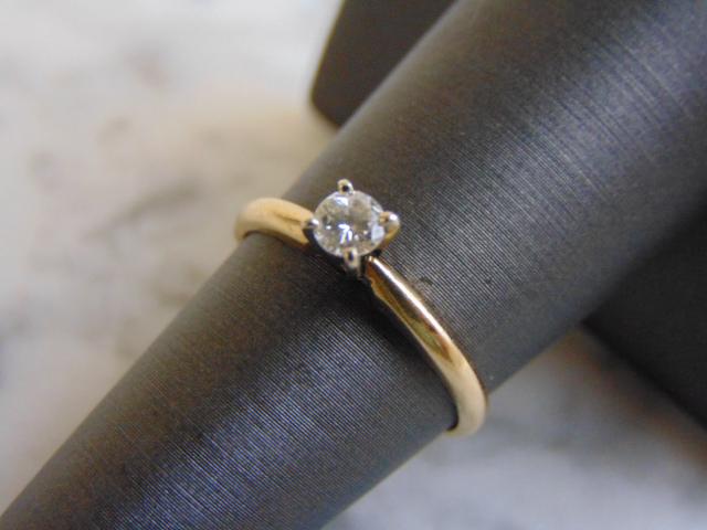 Womens Vintage Estate 14k Gold Diamond Engagement Ring: 14k Yellow Gold Diamond Engagement RingSIZE: 6.5WEIGHT: 2.1gDIAMOND: .20cts , VERY NICE SHIMMERCUT: ROUND BRILLIANTCOLOR: N/ACLARITY: N/ADIAMOND SPECS ARE AN OPINION, NOT AN OFFICIAL GRADEANY QUESTION