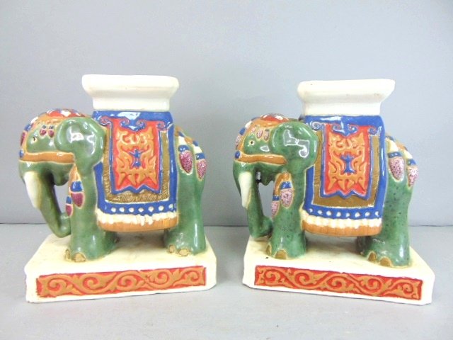 Vintage Decorative Porcelain Chinese Elephant Bookends: VINTAGE DECORATIVE PORCELAIN CHINESE ELEPHANT BOOKENDS THAT EACH MEASURE 8 1/4" TALL BY 4" WIDE BY 7" LONG. BOTH PIECES ARE IN GOOD CONDTION. AN AMAZING PIECE TO ADD TO YOUR BOOKSHELF AT HOME OR AT TH