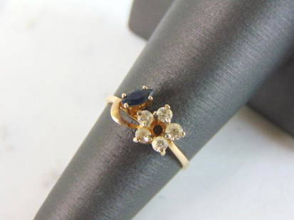 Womens Vintage Estate 10k Yellow Gold Sapphire Ring: A WOMEN'S 10K YELLOW GOLD SAPPHIRE RING. RING HAS A SAPPHIRE STONE AND CZ, NOT DIAMONDS. THE RING WEIGHS 1.6g, AND IS A SIZE 5.75. MAKES A LOVELY GIFT FOR THAT SOMEONE SPECIAL. ANY OTHER