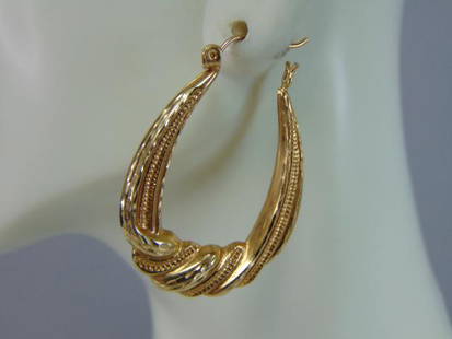 Womens Vintage Estate 14K Yellow Gold Hoop Earrings: A PAIR OF WOMENS VINTAGE ESTATE 14K GOLD HOOP EARRINGS. THE EARRINGS WEIGH 3.2g, AND MEASURE 1 1/4" BY 1". EARRINGS ARE STAMPED "SEC 14K" ON THE CLASP. EARRINGS ARE HOLLOW. WOULD MAKE A GREAT