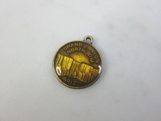 Womens Vintage Sterling Silver Grand Canyon Charm: FOR SALE IS A VINTAGE ESTATE WOMEN'S STERLING SILVER GRAND CANYON CHARM . CHARM MEASURES 5/8" LONG BY 1/2" WIDE AND WEIGHS 1.1g. MAKES A GREAT GIFT FOR THAT SOMEONE SPECIAL. IF ANY QUESTIONS, PLEASE A