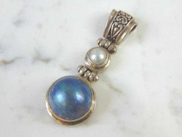 Womens Vintage Sterling Silver Lapis Lazuli Penant: FOR SALE IS THIS VERY NICE STERLING SILVER LAPIS LAZULI PENDANT THAT WEIGHS 9.9g. NOT SURE IF STONE IS REAL OR MAN MADE. THE PENDANT MEASURES 1 7/8" BY 3/4". ANY OTHER QUESTIONS PLEASE DONT HESITATE T