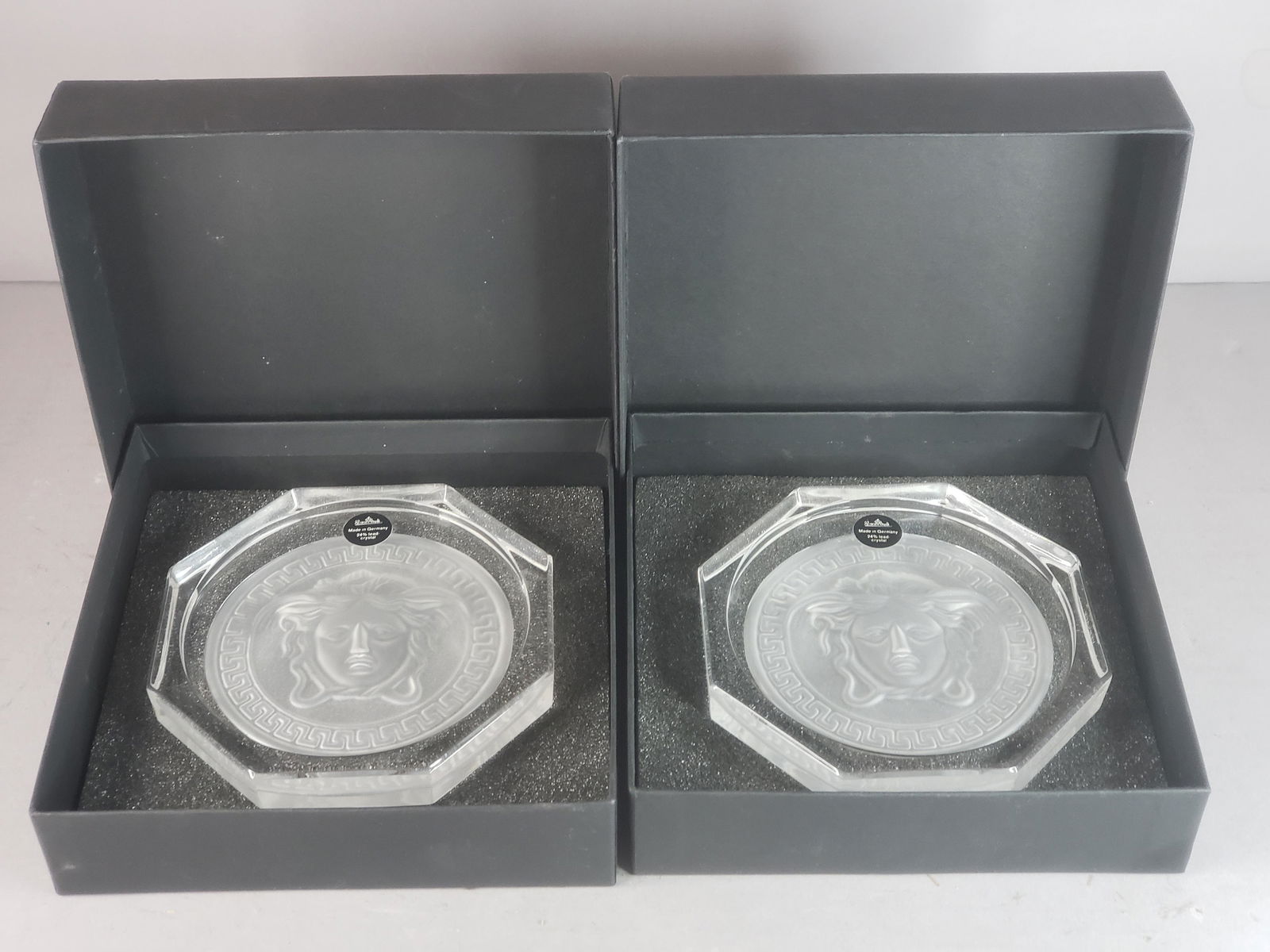 PR VERSACE BY ROSENTHAL MEDUSA LUMIERE CRYSTAL COASTERS: A PAIR OF VERSACE BY ROSENTHAL MEDUSA LUMIERE CRYSTAL COASTERS. EACH ONE MEASURES 4 1/4" WIDE, AND COME WITH THEIR ORIGINAL BOX. SHIPPING AND HANDLING IS $20 WITHIN THE CONTINENTAL U.S. ALL OTHER STAT