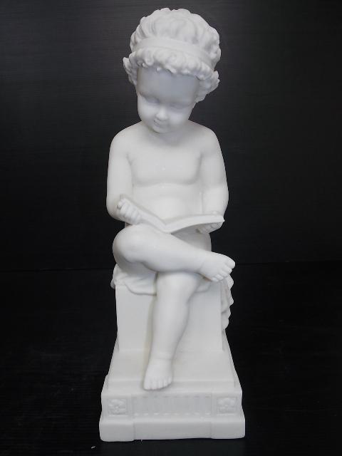 VICTORIAN STATUE OF BOY READING BOOK W/ MARBLE FINISH: AN AMAZINGLY DECORATIVE AND HIGH QUALITY VICTORIAN STYLE STATUE OF A BOY READING A BOOK. THE STATUE STANDS 15" TALL BY 5 1/2" WIDE. STATUE IS MADE OF RESIN WITH A MARBLE FINISH. GREAT PIECE TO ADD TO 