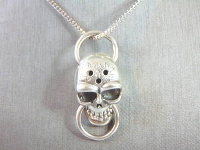 Sterling Silver Gothic Skull Pendant w/ Necklace: A LOVELY VINTAGE .925 STERLING SILVER GOTHIC SKULL PENDANT WITH A ROPE NECKLACE. THE TOTAL WEIGHT OF THE PENDANT AND NECKLACE IS 21.2g. THE PENDANT MEASURES 1 3/8" LONG BY 5/8" WIDE. THE NECKLACE MEAS