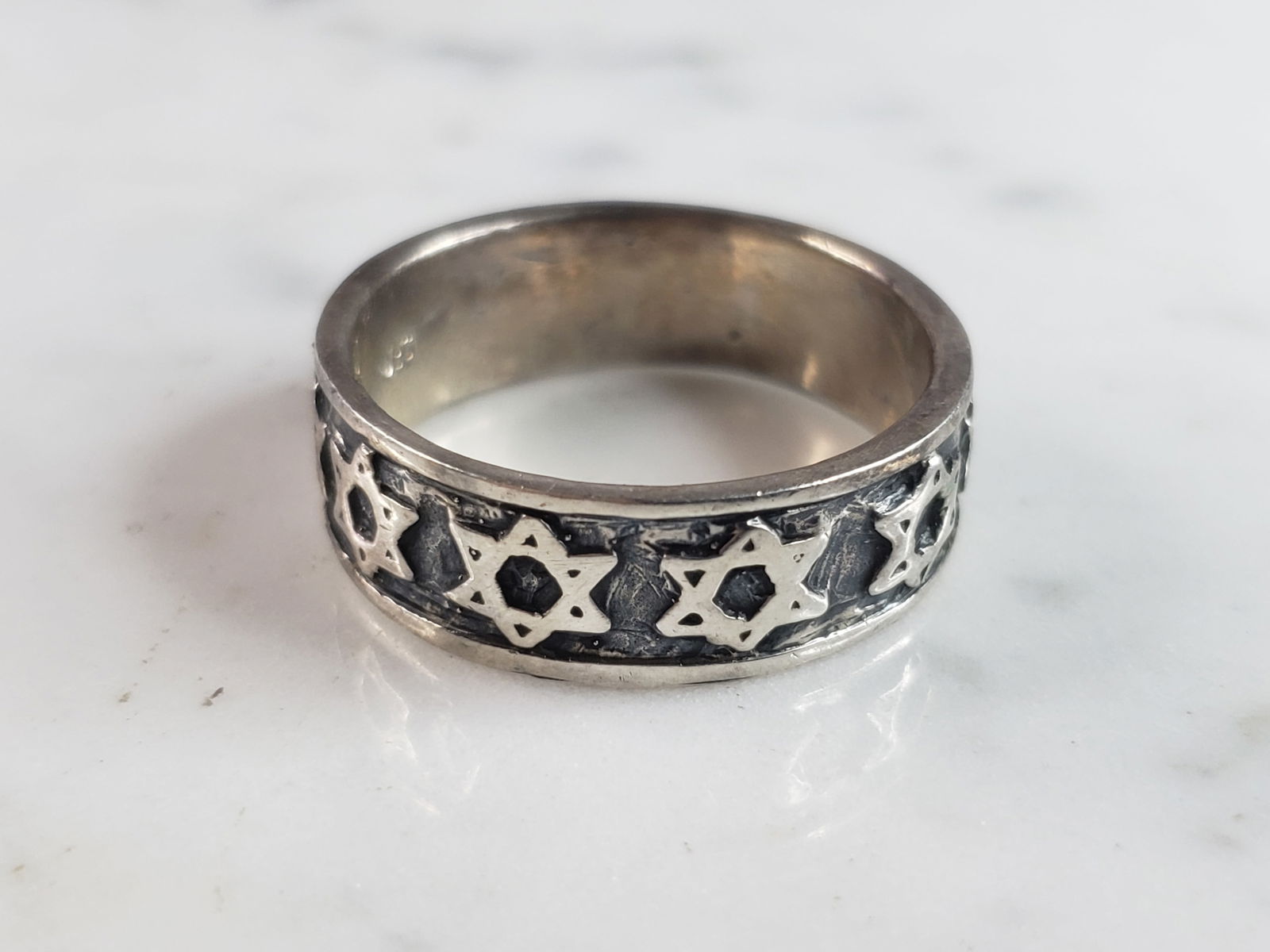 Mens Vintage Estate Sterling Silver Jewish Star of David Band Ring: A MENS VINTAGE ESTATE STERLING SILVER JEWISH STAR OF DAVID WEDDING RING. THE RING WEIGHS 9.2g AND IS A SIZE 13.0. WIDTH OF THE RING IS 5/16". THIS WOULD MAKE A NICE GIFT FOR THAT SOMEONE SPECIAL. ANY