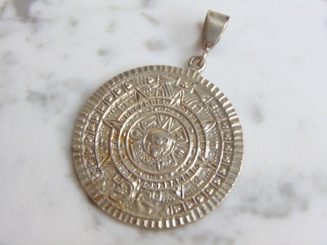 Womens Vintage Estate Sterling Silver Mayan Pendant: FOR SALE IS THIS WOMENS VINTAGE ESTATE .925 STERLING SILVER MAYAN PENDANT . PENDANT WEIGHS 27.4g AND PENDANT MEASURES 2 5/8" LONG BY 1 3/4" WIDE. MAKES A GREAT GIFT FOR THAT SOMEONE SPECIAL. IF ANY QU