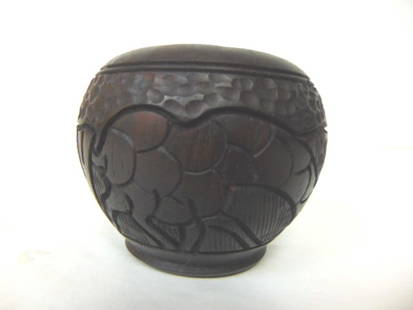 Vintage Hand Carved African Giraffe Cabinet Vase: A beautiful vintage or antique hand carved African cabinet vase decorated with what looks like giraffes. The vase measures about 2 3/4" tall by about 3" wide. Condition looks good for its age. Any que