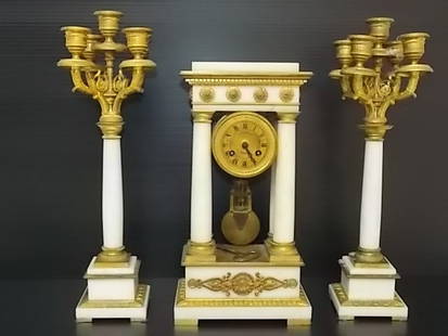 VICTORIAN FRENCH TIFFANY & CO CLOCK W/ CANDLEABRAS: FOR SALE IS THIS LOVELY RARE ANTIQUE VICTORIAN 3PC PORTICO CLOCK MADE BY TIFFANY & CO IN FRANCE. I BELIEVE IT TO BE MADE OF ALIBASTER BUT NOT 100%. THE CLOCK ITSELF MEASURES 13 1/2" TALL BY 7" LONG BY
