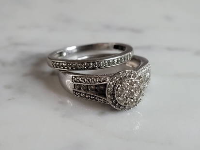 Womens Vintage Estate 10K White Gold Diamond Wedding Ring Set: A WOMENS VINTAGE 10K WHITE GOLD DIAMOND ENGAGEMENT WEDDING RING SET. THERE ARE ABOUT 1.28cts OF DIAMONDS IN THIS SET. THE TOTAL WEIGHT IS 6.5g, AND IS A SIZE 7.0. THE WIDTH OF THE SET IS 3/8". ANY QUE