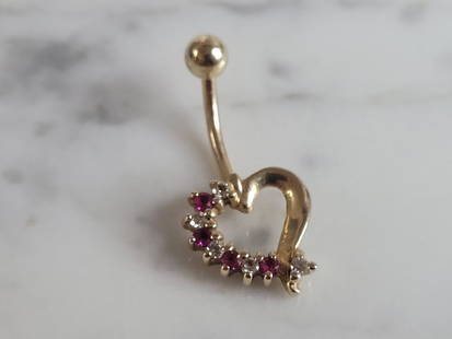Womens Vintage Estate 14K Gold Diamond Heart Belly Button Ring: A WOMENS VINTAGE ESTATE 14K YELLOW GOLD DIAMOND AND RUBY HEART BELLY BUTTON RING. PIECE WEIGHS 2.9g AND MEASURES 1" LONG BY 1/2" WIDE. THERE ARE ABOUT .05cts OF DIAMONDS. ANY OTHER QUESTIONS, PLEASE D