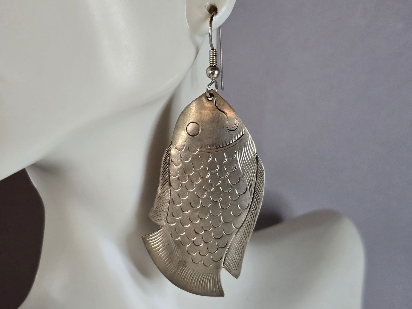 Womens Vintage Estate Sterling Silver Fish Earrings: A PAIR OF WOMENS VINTAGE ESTATE STERLING SILVER FISH EARRINGS. THE EARRINGS WEIGH 7.6g AND MEASURE 2 5/8" BY 1". EARRINGS ARE NOT MARKED, BUT HAVE BEEN TESTED AND ARE GUARANTEED TO BE AS DESCRIBED. AN