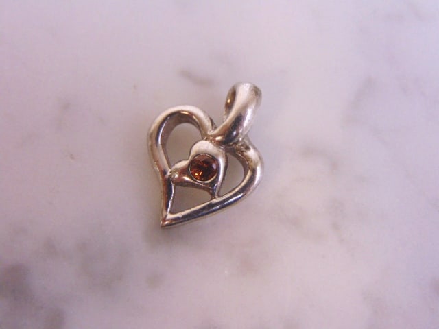 Womens Vintage Estate Sterling Silver Heart Pendant: FOR SALE IS THIS LOVELY VINTAGE STERLING SILVER HEART PENDANT. PENDANT HAS A CITRINE LIKE STONE, NOT SURE IF REAL OR MAN MADE. THE TOTAL WEIGHT IS 1.9g. THE PENDANT MEASURES 3/4" WIDE BY 1/2" LONG. MA