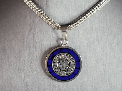 Womens Vintage Estate Sterling Silver Mayan Pendant Necklace: A WOMENS VINTAGE ESTATE STERLING SILVER REVERSIBLE MAYAN PENDANT WITH NECKLACE. TOGETHER THEY WEIGH 40.4g. PENDANT MEASURES 2" LONG BY 1 1/4" WIDE, AND THE NECKLACE MEASURES 23 1/2" BY 1/4". MAKES A G