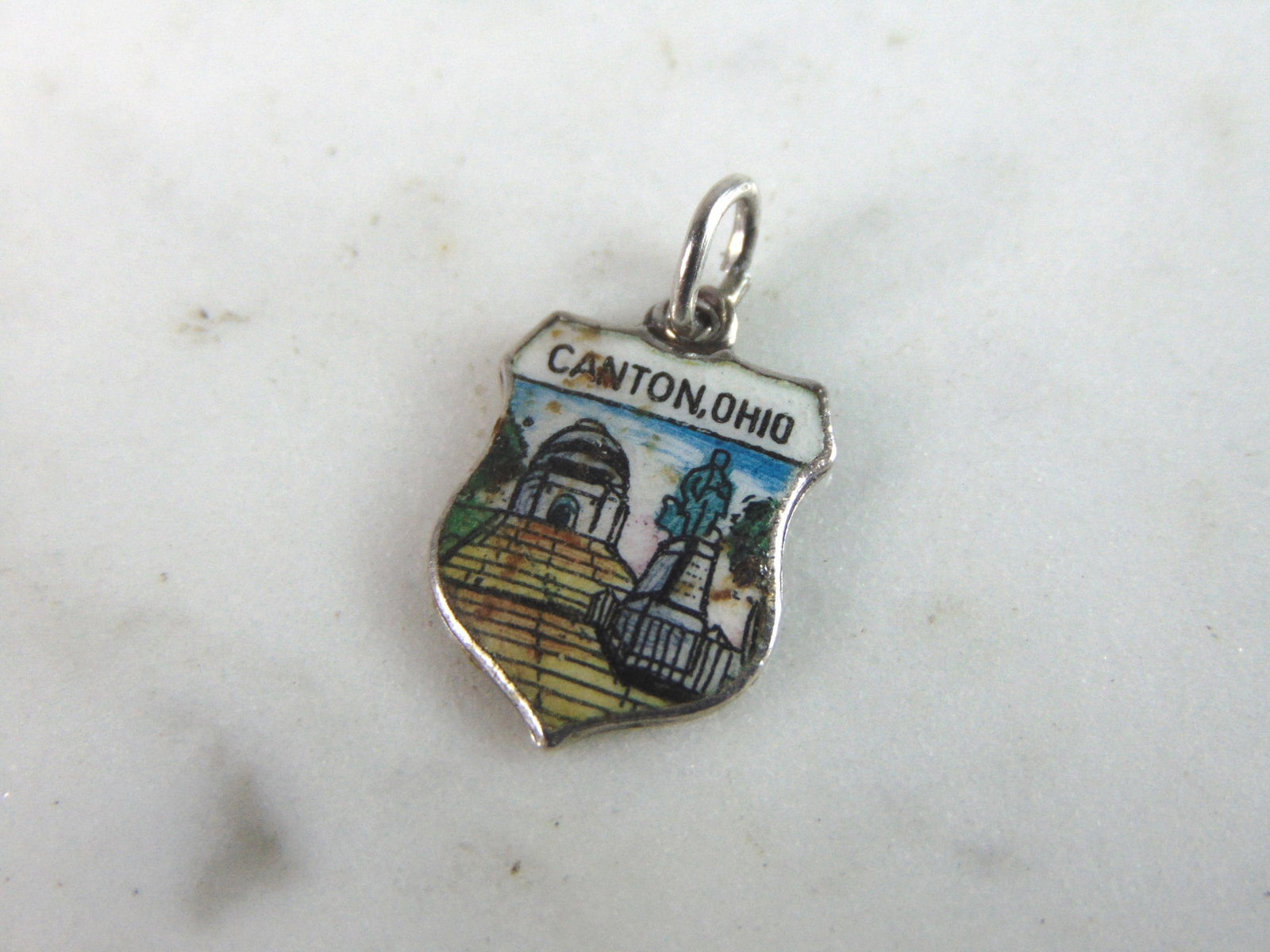 Womens Vintage Estate Sterling Silver Canton, Ohio Charm: FOR SALE IS THIS WOMENS VINTAGE ESTATE STERLING SILVER CANTON, OHIO CHARM. CHARM WEIGHS 0.9g AND MEASURES 3/4" LONG BY 5/8" WIDE. MAKES A GREAT GIFT FOR THAT SOMEONE SPECIAL. IF ANY QUESTIONS, PLEASE 