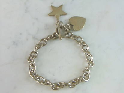 Womens Vintage Estate Sterling Silver Charm Bracelet: FOR SALE IS A LOVELY VINTAGE ESTATE .925 STERLING SILVER CHARM BRACELET. BRACELET MEASURES 8" LONG BY 3/8" WIDE AND WEIGHS 34.2g. THIS WOULD MAKE A LOVELY GIFT FOR THAT SOMEONE SPECIAL. ANY QUESTIONS,