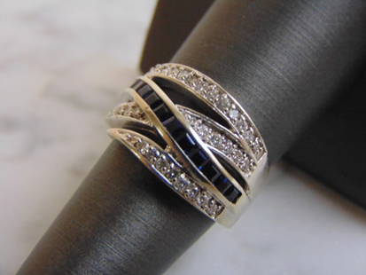 Womens Vintage 14K White Gold Sapphire & Diamond Ring: FOR SALE IS THIS VINTAGE ESTATE 14K WHITE GOLD SAPPHIRE & DIAMOND RING. THE RING IS A SIZE 7.25 AND WEIGHS 7.4g. THERE ARE ABOUT .70cts OF DIAMONDS. NOT SURE IF THE SAPPHIRE STONES ARE REAL OR MANMADE