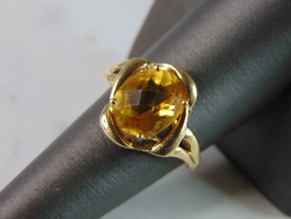 Womens Vintage Estate 10K Yellow Gold Citrine Ring: A WOMENS VINTAGE ESTATE 10K GOLD CITRINE RING. THE RING IS A SIZE 8.0, AND WEIGHS 3.4g. THE STONE IS ABOUT 11.7cts. RING IS MARKED ON THE INSIDE OF THE BAND. ANY QUESTIONS PLEASE DONT HESITATE TO ASK.