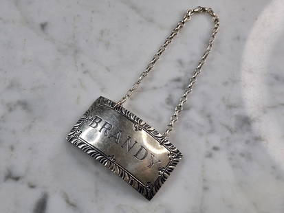 Sterling Silver Williamsburg Stieff Brandy Liquor Decanter Tag Label: A VINTAGE STERLING SILVER BRANDY LIQUOR DECANTER TAG, MADE BY STIEFF FOR COLONIAL WILLIAMSBURG. THE TAG WEIGHS 13.9g. THE TAG ITSELF MEASURES 1 7/8" BY 1". APPEARS TO BE IN GOOD VINTAGE CONDITION. ANY