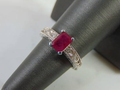 Womens Vintage 14k White Gold Garnet & Diamond Ring: FOR SALE IS THIS LOVELY VINTAGE ESTATE 14K WHITE GOLD RING WITH AN EMERALD CUT GARNET STONE AND DIAMOND CHIPS. RING IS A SIZE 6.5 AND WEIGHS 4.9g. THERE ARE ABOUT .04cts OF DIAMONDS. THE GARNET IS ABO