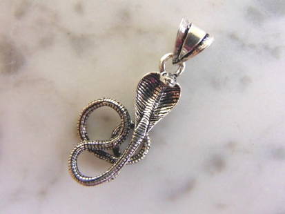 Vintage Estate Sterling Silver Snake Pendant: A VINTAGE ESTATE STERLING SILVER SNAKE PENDANT. THE PENDANT WEIGHS 2.6g AND MEASURES 1 3/8" LONG BY 1/2" WIDE. MAKES A GREAT GIFT FOR THAT SPECIAL SOMEONE. ANY QUESTIONS, PLEASE DO NOT HESITATE TO