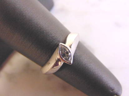 Womens Sterling Silver Ring w/ Marquise Cut Stone: A WOMENS VINTAGE ESTATE STERLING SILVER RING WITH A MATTE FINISH THAT HAS A MARQUISE CUT STONE. THE RING SIZE IS 5.25 AND WEIGHS 2.5g. THE WIDTH OF THE RING IS 3/8". ANY OTHER QUESTIONS PLEASE DONT