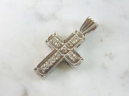 Vintage Estate 14K Gold Diamond Cross Pendant: A VINTAGE ESTATE 14K WHITE GOLD DIAMOND CROSS PENDANT. THE PENDANT MEASURES 1 1/2" BY 3/4", AND WEIGHS 11.5g. THERE ARE ABOUT .65cts OF DIAMONDS. PENDANT IS NOT MARKED BUT IT HAS BEEN TESTED AND IS GU