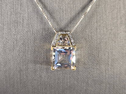 Womens Vintage Estate Modernist Sterling Silver CZ Pendant Necklace: A WOMENS VINTAGE ESTATE MODERNIST STERLING SILVER CZ PENDANT WITH NECKLACE WITH SOME GOLD TONE ACCENTS. THE TOTAL WEIGHT IS 6.2g. PENDANT MEASURES 3/4" LONG BY 1/2" WIDE, AND THE NECKLACE IS 18"