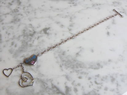 Womens Vintage Sterling Silver Heart Charm Bracelet: FOR SALE IS A LOVELY VINTAGE ESTATE .925 STERLING SILVER HEART CHARM BRACELET THAT MEASURES 7 5/8" LONG BY 1/4" AND WEIGHS 12.5g. THIS WOULD MAKE A LOVELY GIFT FOR THAT SOMEONE SPECIAL. ANY QUESTIONS,