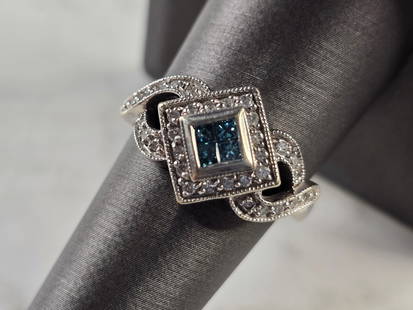 Womens Vintage Estate 14K White Gold Blue Diamond Ring: A WOMENS VINTAGE ESTATE 14K WHITE GOLD RING WITH BLUE & WHITE DIAMONDS. THE RING WEIGHS 6.2g, AND IS A SIZE IS 8.5. THERE ARE 32 WHITE DIAMONDS, AND 4 BLUE DIAMONDS. WIDTH OF THE RING IS 1/2". RING IS