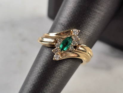 Womens Vintage Estate 14K Yellow Gold Emerald & Diamond Ring: A WOMENS VINTAGE ESTATE 14K YELLOW GOLD EMERALD & DIAMOND RING. THE RING WEIGHS 5.0g, AND IS A SIZE 6.75. THERE ARE ABOUT .16cts OF DIAMONDS, AND THE EMERALD IS ABOUT .20cts. THE LENGTH OF THE RING IS