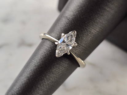 Womens Vintage Estate 14K White Gold Marquise Diamond Engagement Ring: A WOMEN'S VINTAGE ESTATE 14K WHITE GOLD ENGAGEMENT RING WITH A MARQUISE CUT DIAMOND THAT IS ABOUT .75ct IN SIZE. THE SIZE OF THE RING IS A 6.0, AND WEIGHS 3.0g. THE LENGTH OF THE RING IS 3/8". RING IS