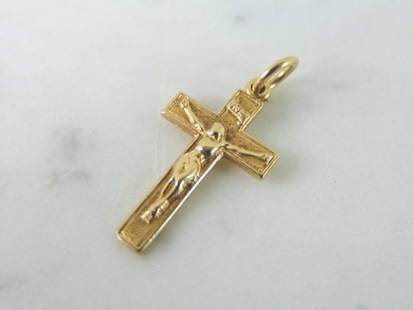 Vintage Estate 14K Gold Religious Jesus Cross Pendant: A VINTAGE ESTATE 14K YELLOW GOLD JESUS ON A CROSS PENDANT. THE PENDANT WEIGHS 1.4g AND MEASURES 1" LONG BY 1/2" WIDE. PENDANT IS NOT STAMPED, BUT IT HAS BEEN TESTED AND IS GUARANTEED TO BE AS DESCRIBE