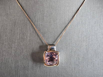 Womens Sterling Silver 14K Gold Amethyst Pendant W/ Necklace: A WOMENS VINTAGE ESTATE STERLING SILVER AND 14K GOLD AMETHYST COLORED STONE PENDANT WITH NECKLACE. NOT SURE IF STONE IS NATURAL OR MAN MADE. TOGETHER NECKLACE AND PENDANT WEIGHS 8.4g. PENDANT MEASURES