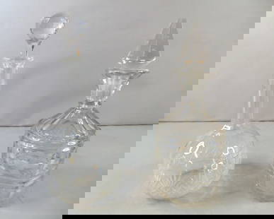 Lot of Vintage Pressed Glass Liquor/ Wine Decanters: LOT OF VINTAGE ANTIQUE PRESSED GLASS LIQUOR / WINE DECANTERS. ONE MEASURES 11 7/8" TALL BY 5" WIDE THE OTHER MESURES 11 1/2" TALL BY 4 1/4 WIDE. SQUARED DECANTER HAS SMALL CHIPS AND THE OTHER ONE HAS