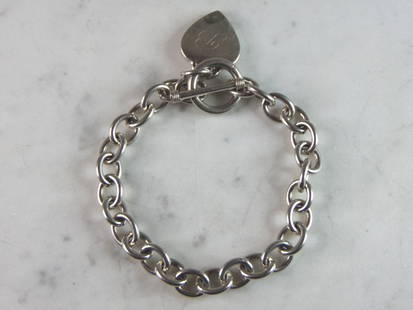 Womens Vintage Estate Sterling Silver Charm Bracelet: A WOMENS VINTAGE ESTATE STERLING SILVER CHARM BRACELET. BRACELET IS 7 5/8" LONG BY 3/8" WIDE, AND WEIGHS 32g. THIS WOULD MAKE A LOVELY GIFT FOR THAT SOMEONE SPECIAL. BE SURE TO CHECK OUT SOME OF MY OT