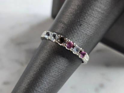 Womens Vintage Estate 10k White Gold Ring: A WOMENS VINTAGE ESTATE 10K WHITE GOLD RING WITH MULTI COLORED STONES. NOT SURE IF STONES ARE MANMADE OR NATURAL. THE RING WEIGHS 1.6g, AND IS A SIZE 6.5. THE WIDTH OF THE RING IS 1/8". ANY