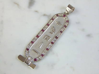 Vintage Estate 18K White Gold Egyptian Pendant: FOR SALE IS THIS LOVELY VINTAGE ESTATE 18K WHITE GOLD EGYPTIAN PENDANT. THE PENDANT MEASURES 2 1/2" BY 5/8", AND WEIGHS 7.1g. THE STONES ARE RUBIES AND DIAMONDS. THERE ARE ABOUT .16cts OF EACH. PENDAN
