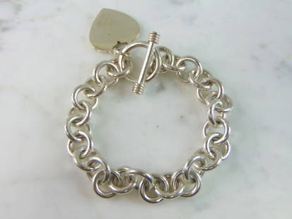 Womens Vintage Estate Sterling Silver Charm Bracelet: FOR SALE IS A LOVELY VINTAGE ESTATE STERLING SILVER CHARM BRACELET, THAT WEIGHS 43.3g. THE BRACELET MEASURES 7" LONG BY 3/8" WIDE. ANY QUESTIONS PLEASE DO NOT HESITATE TO ASK. BE SURE TO CHECK OUT SOM