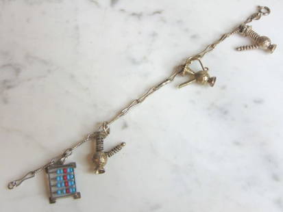 Womens Vintage Estate Sterling Silver Charm Bracelet: FOR SALE IS A LOVELY WOMENS VINTAGE ESTATE STERLING SILVER CHARM BRACELET. BRACELET MEASURES 7 1/4" LONG BY 1 1/8" WIDE AND WEIGHS 11.6g. THIS WOULD MAKE A LOVELY GIFT FOR THAT SOMEONE SPECIAL. ANY QU