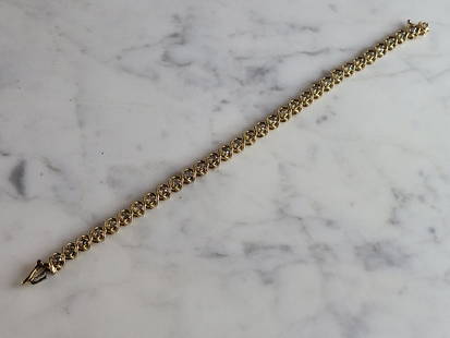 Womens Vintage Estate 14K Yellow Gold Diamond Tennis Bracelet: A WOMENS VINTAGE ESTATE 14K YELLOW GOLD DIAMOND TENNIS BRACELET WITH ABOUT 1.5cts IN DIAMONDS. THE BRACELET MEASURES 7" LONG BY 1/4" WIDE, AND WEIGHS 14.3g. BRACELET DOES HAVE A MINOR FLAW. THE HORSES