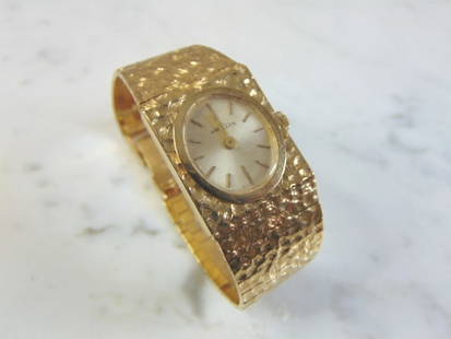 Womens Vintage 14K Gold Angelus Swiss Watch: A WOMENS VINTAGE ESTATE 14K GOLD WATCH MADE BY ANGELUS. THE WATCH WEIGHS 49.6g WITH THE WORKS. WATCH MEASURES 6 1/2" LONG. WATCH DOES NOT WORK. NOT SURE IF IT NEEDS A NEW BATTERY OR JUST SOME SIMPLE A